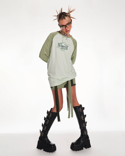 Time Traveler Oversized Raglan Long Sleeve Top With Graphic In Green