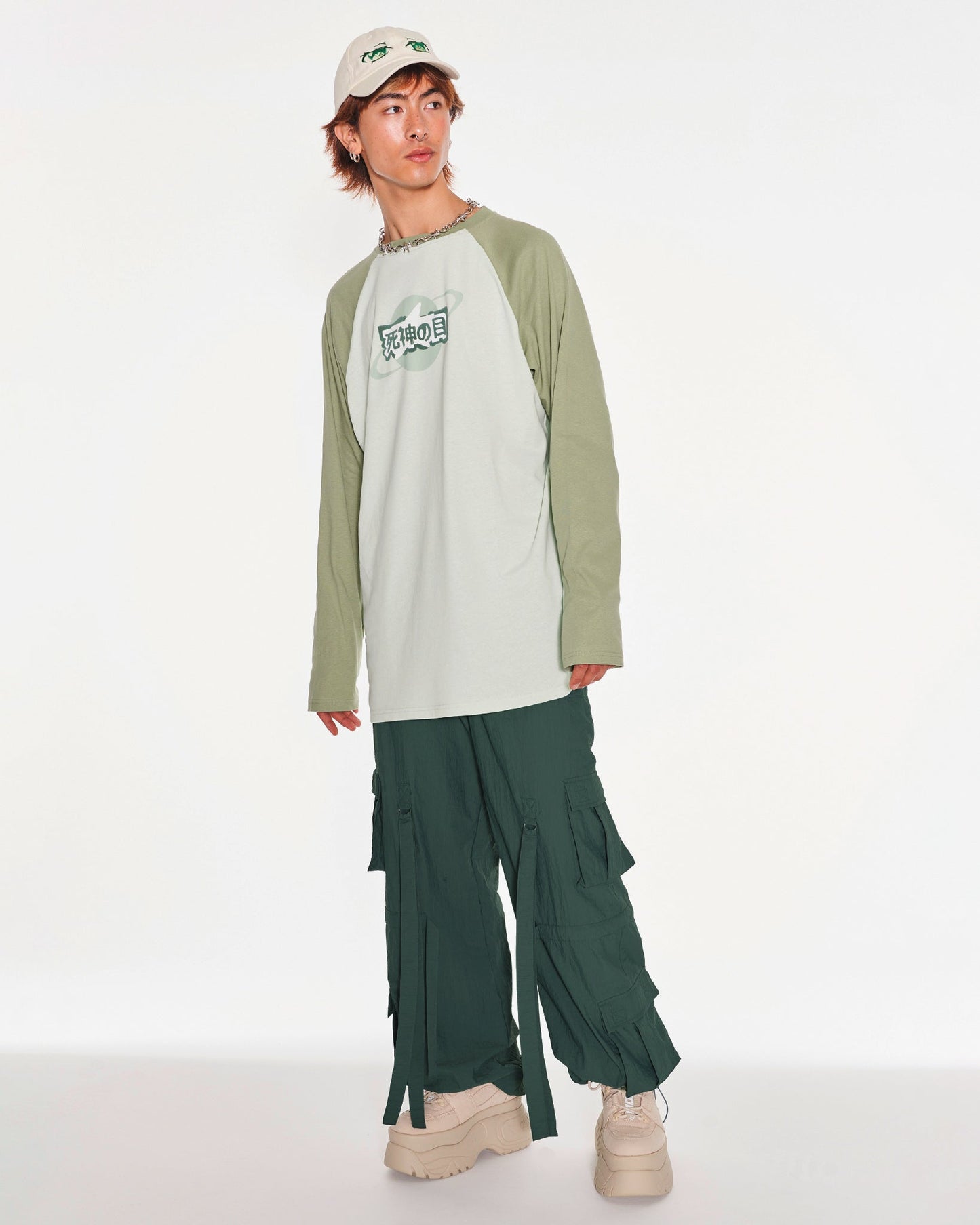 Time Traveler Oversized Raglan Long Sleeve Top With Graphic In Green